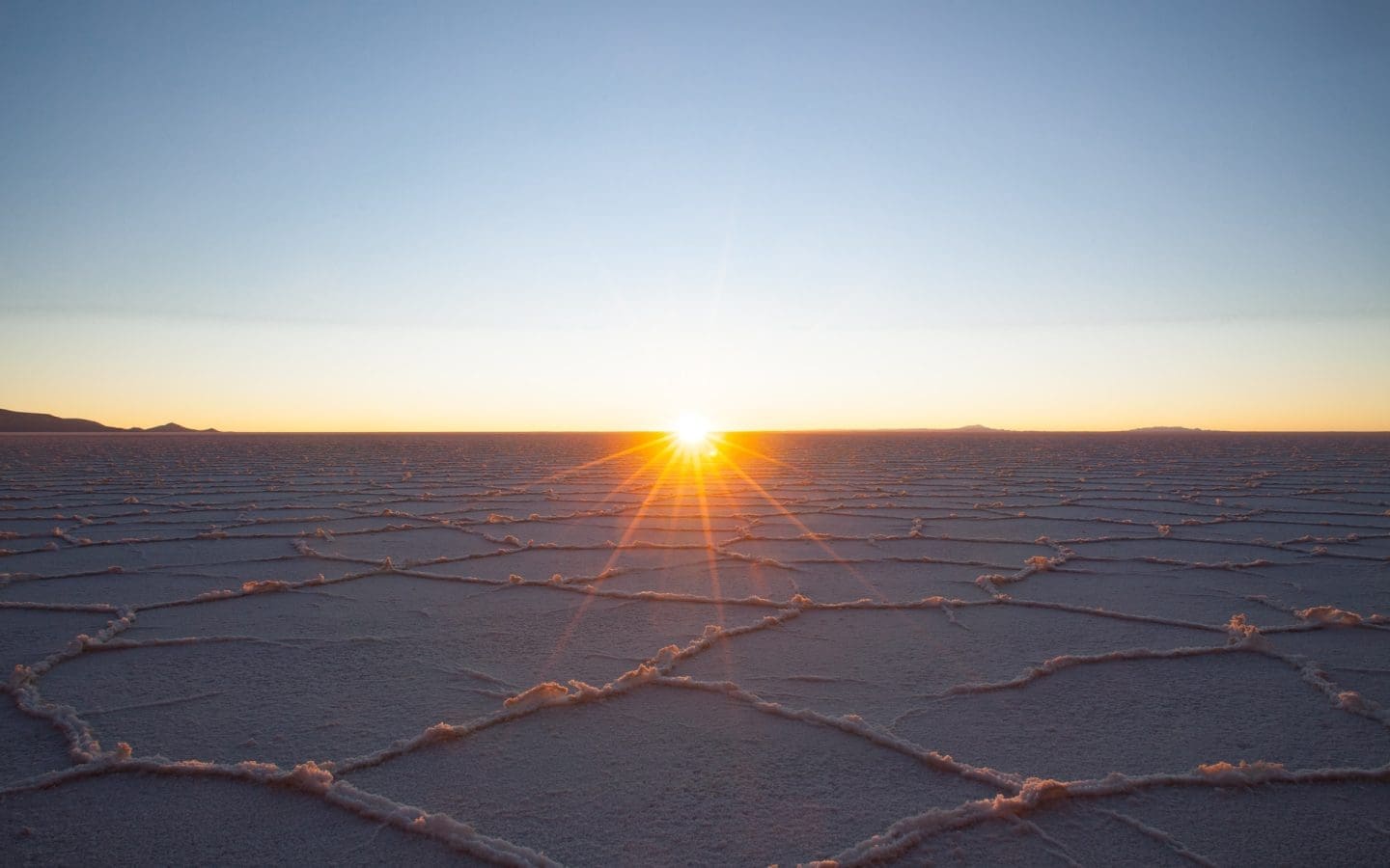 Sunrise over salt flats.