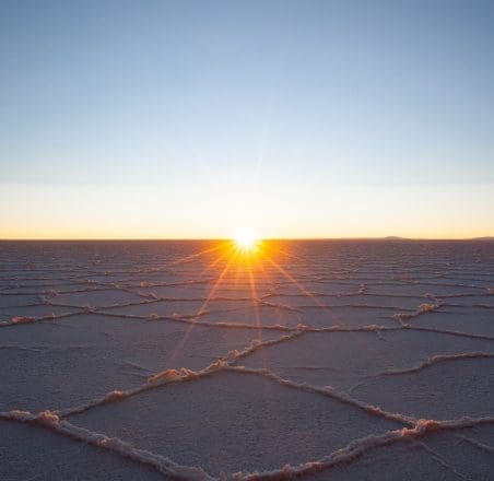 Sunrise over salt flats.